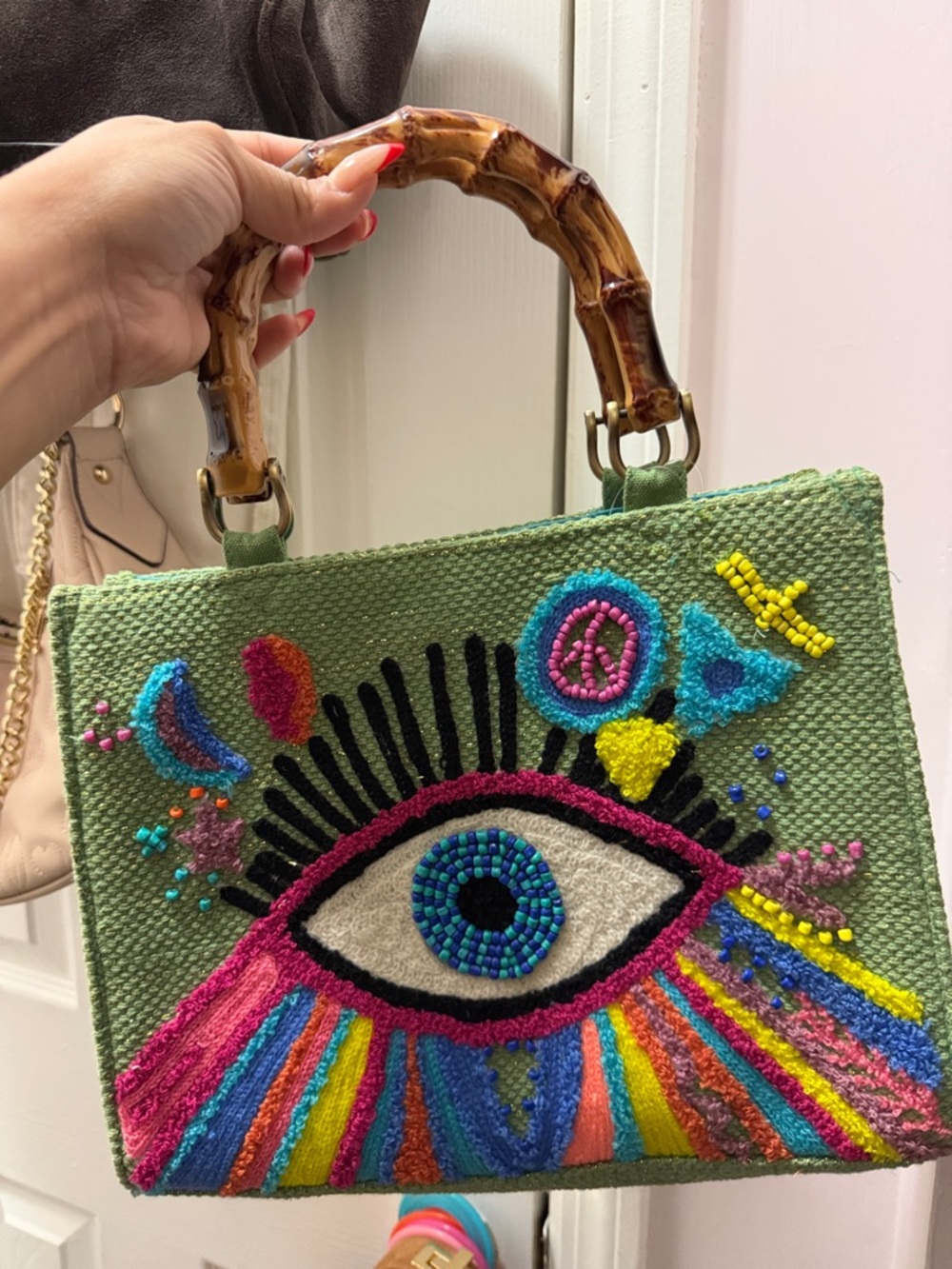 Hand-Embroidered Green Mini Bag with Colorful Eye Motif